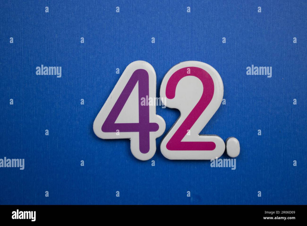 The Number 42 Placed On A Blue Background Photographed From Above 